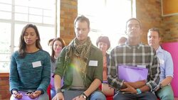 Serene people with eyes closed in audience Stock Footage
