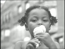 A little girl eats an ice cream cone. News Clip