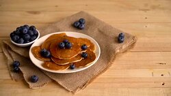 Stack of pancakes with fresh blueberry Stock Footage
