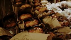 At the bakery. Poppy sprinkled challahs on the shelf Stock Footage