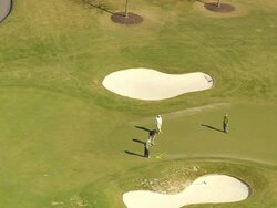 MS AERIAL ZI Shot of men at golf course / North Carolina, United States Stock Footage