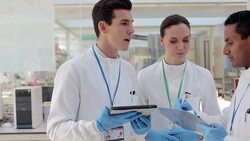 Scientists working together in laboratory Stock Footage