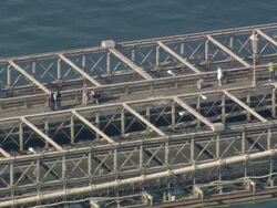 AERIAL Cars and pedestrians crossing Brooklyn Bridge / New York City, New York, USA Stock Footage