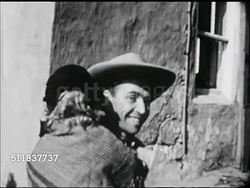 MOT: EARLY AMERICANA: WESTWARD EXPANSION REENACTMENT: Father, male picking up rifle at porch edge, daughter, girl  running to father. Father handing daughter up to mother on Conestoga covered wagon. Instructional Video