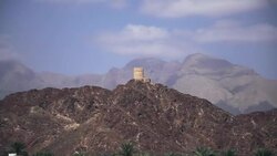 Motion shot of historic Portuguese outpost on hilltop in Oman Stock Footage