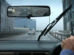 Driving on a rainy wet day with poor visibility and spray on the elevated section of the M4 Motorway, near to Chiswick in west London. Stock Footage