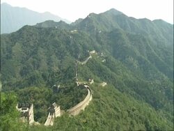EWA forested mountain area, with Great Wall of China snaking along ridge line, Mutianyu, China Stock Footage