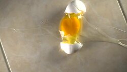 egg dropped Stock Footage