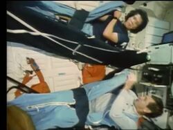Astronauts getting into sleeping bags on Space Shuttle Atlantis Stock Footage