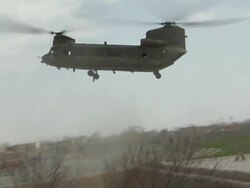 WS PAN View of landing military helicopter / Musa Qala, Helmand Province, Afghanistan. Stock Footage