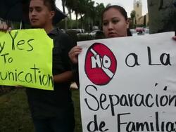 Mid to close-up shot of protesters with banners Immigration Activists Protest Outside Of Marco Rubio Fundraiser at Biltmore Hotel on April 05, 2013 in Miami, Florida (Footage by Getty Images)Immigration Activists Protest Outside Of Marco Rubio Fundraiser Stock Footage