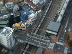 High elevation view of Tokyo city showing modes of transport using Lensbaby, Japan, Asia Stock Footage