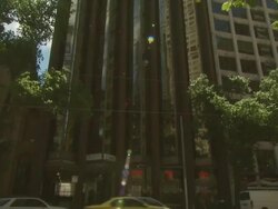 Taxis driving past tower block, Australia Stock Footage
