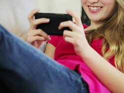 Pretty young teenage girl sending text message Stock Footage