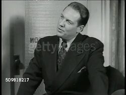 1944: U.S. MANUFACTURERS: PAYROLL: VS Two men in office '...factories will be employing more people after the war... more people buying from you, more goods, more people...' CU Employee forms dropping into basket. Instructional Video