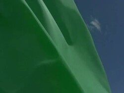 Blank Green Flag with blue sky background Stock Footage