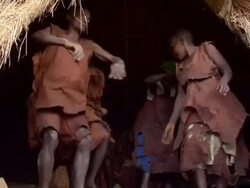 MS Shot of men and woman of batwa doing tribe dance on native song AUDIO / kigez, kabale, uganda Stock Footage