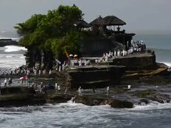 WS View of Procession at Tanah Lot temple on rocky island / Tanah Lot, Bali, Indonesia Stock Footage