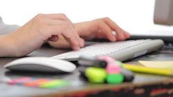 Young woman typing at computer keyboard. Stock Footage