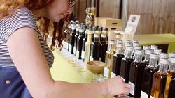 Woman Eating Free Samples at Farmers Market Stock Footage