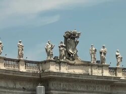 Bernini's colonnade, saints, and tourists in St. Peter's Square, Rome Stock Footage