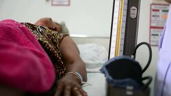 Doctor takes patient's blood pressure Stock Footage