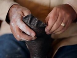 CU PAN boot maker stretching vamp over sole of cowboy boot Stock Footage