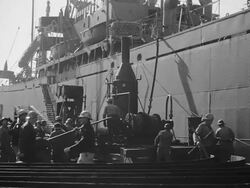 Construction workers building ship on dock. Stock Footage