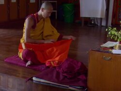 MS Man  carefully wraping  his sacred texts in  red cloth  / Kathmandu, Central, Nepal Stock Footage
