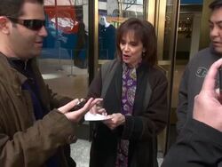 Valerie Harper (Signed Sealed Delivered) exits Christieâ€˜s & poses with & signs for fans, then also poses with Martha Williamson (writer of Signed Sealed Delivered) Stock Footage