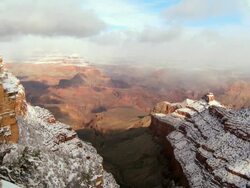 WS Fast Moving clouds over snow covered sandstone in winter / COLORADO,United States  Stock Footage