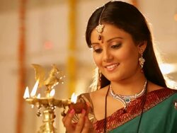 Woman burning oil lamp in diwali festival Stock Footage