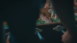 Guys playing tabletop soccer in apartment Stock Footage