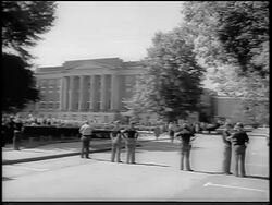 B/W 1963 wide shot National Guard gathered outside U. of Alabama at Tuscaloosa (desegregation) / newsreel Stock Footage