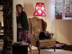 WS PAN Split screen showing  senior woman listening to neighbors argue / Berlin, Germany Stock Footage