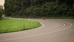 Man riding racing bike Stock Footage