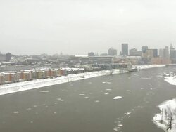 WS T/L Icebergs floating languidly down Mississippi river in front of Cathedral Capitol and Downtown / Saint Paul, Minnesota, United States  Stock Footage