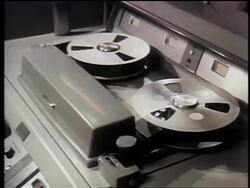 1962 close up reel to reel video tape on video player / first satellite broadcast / documentary Stock Footage