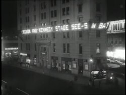 A news ticker runs along the side of a building and announces the 1960 U.S. Presidential Election results. Stock Footage