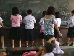 WS SLO MO Children writing on blackboard to finish arithmetic exercises / Vientiane, Laos Stock Footage
