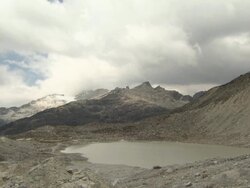 Time lapse of cloudy lake on Huayna Potosi glacier in Andes region of Bolivia Stock Footage