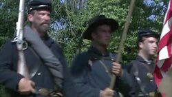 Union soldiers and cavalry move across a field during the Civil War. Stock Footage