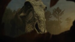 A Tyrannosaurus Rex nurtures its babies as they hatch from eggs in a computer generated animation. Stock Footage