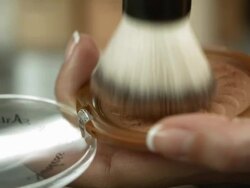 HD: Swirling Brush Into A Face Powder Stock Footage