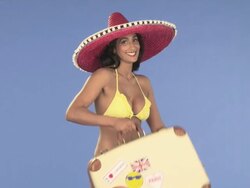 Woman in bikini with sombrero and suitcase Stock Footage