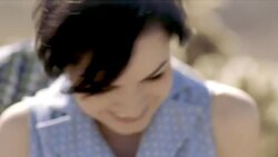 Young couple nuzzle and laugh in cactus grove Stock Footage