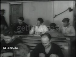 1937: SEAMEN WORKING: WS Cargo ship. Seamen relaxing. Seaman oiler oiling pipes, parts. Machinists monitoring gauges. Instructional Video