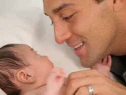 CU Father Talking to Newborn Baby / Richmond, Virginia, USA Stock Footage