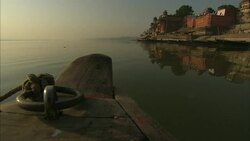 View from the bow of a boat traveling near a shore in India. Stock Footage