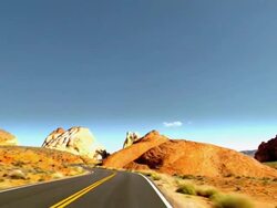 timelapse driving POV over two lane desert road through sandstone formations in Valley of Fire  / Overton, Nevada, USA Stock Footage